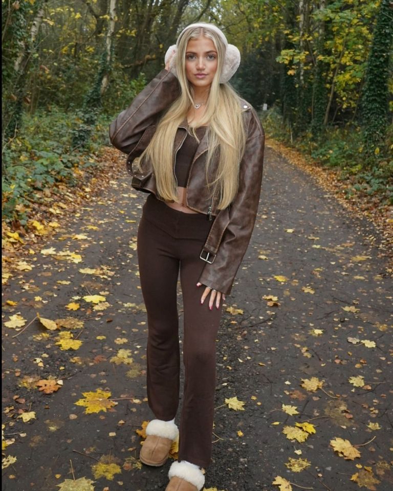 a woman wearing ear muffs and a leather jacket