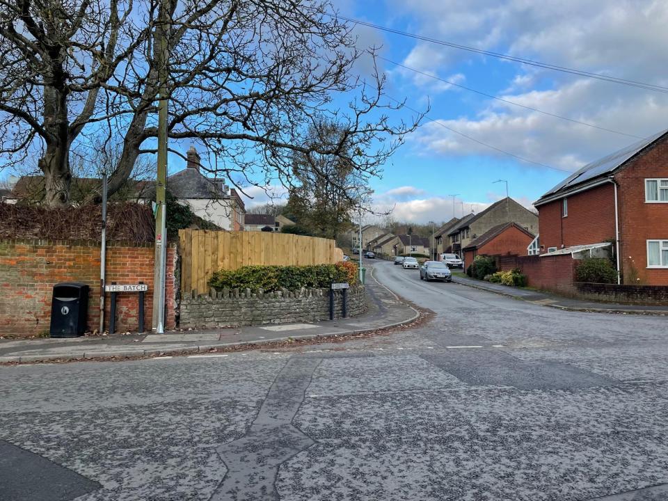 a street corner with a sign that says ' a few steps ' on it