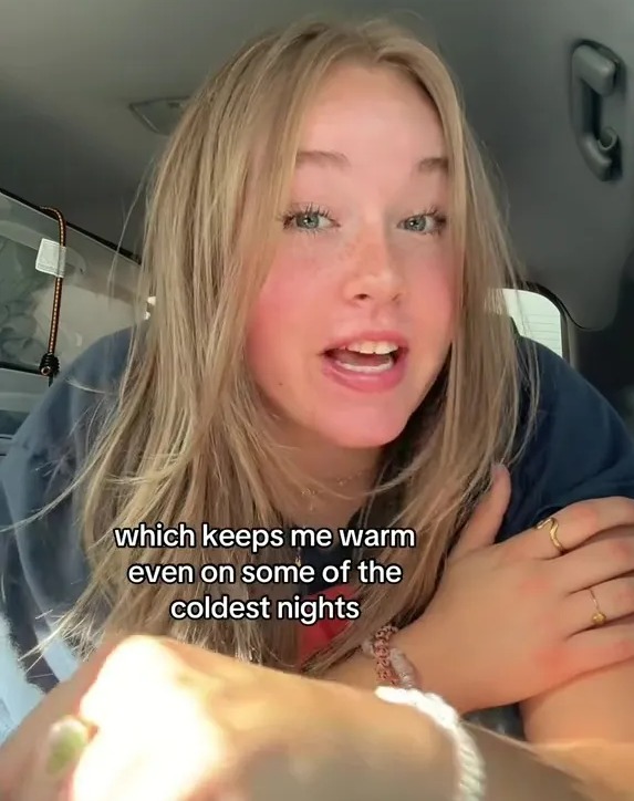 a girl in a car says " which keeps me warm even on some of the coldest nights "