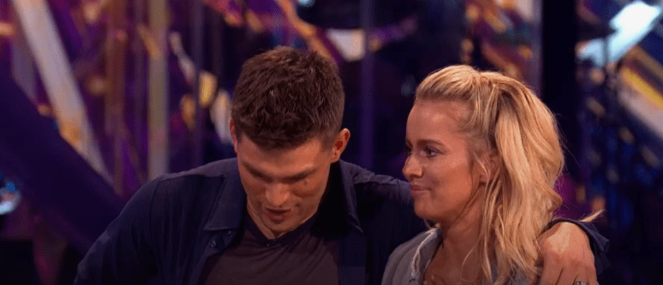 a man and a woman are standing next to each other