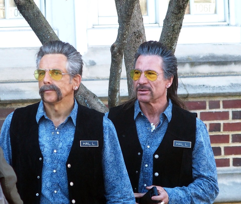 two men wearing vests with the name hall on them