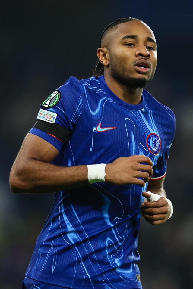a soccer player wearing a blue shirt with the word nation on it