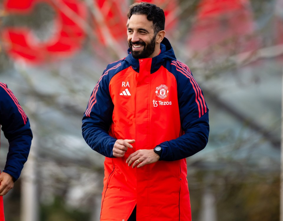 a man wearing a red jacket with the name ra on it