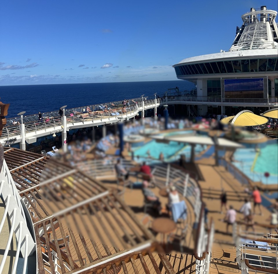 a cruise ship has a large swimming pool on the deck