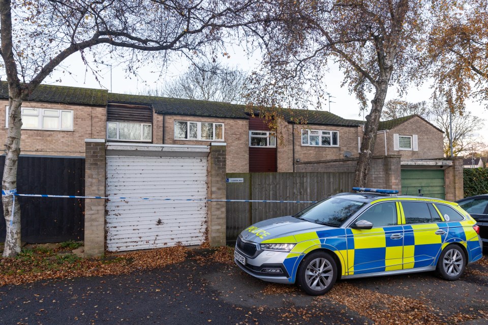 a police car is parked in front of a house