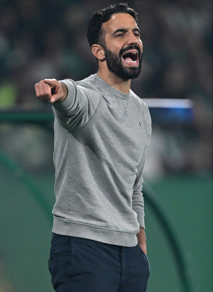 a man with a beard wearing a grey sweatshirt with the letter c on it