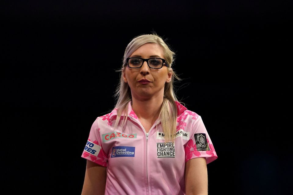 a woman wearing a pink shirt that says empire fighting chance