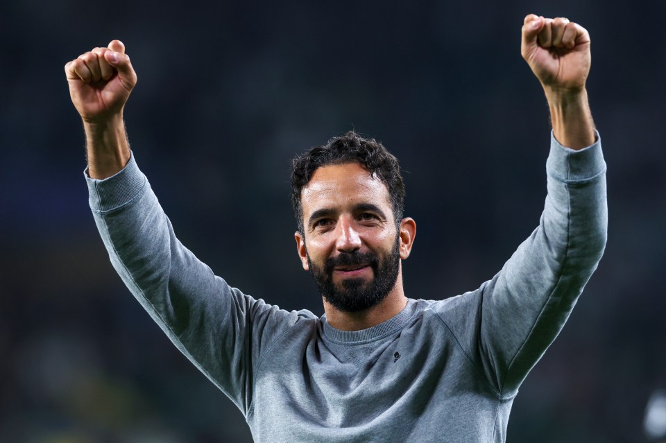 a man with a beard is raising his fist in the air