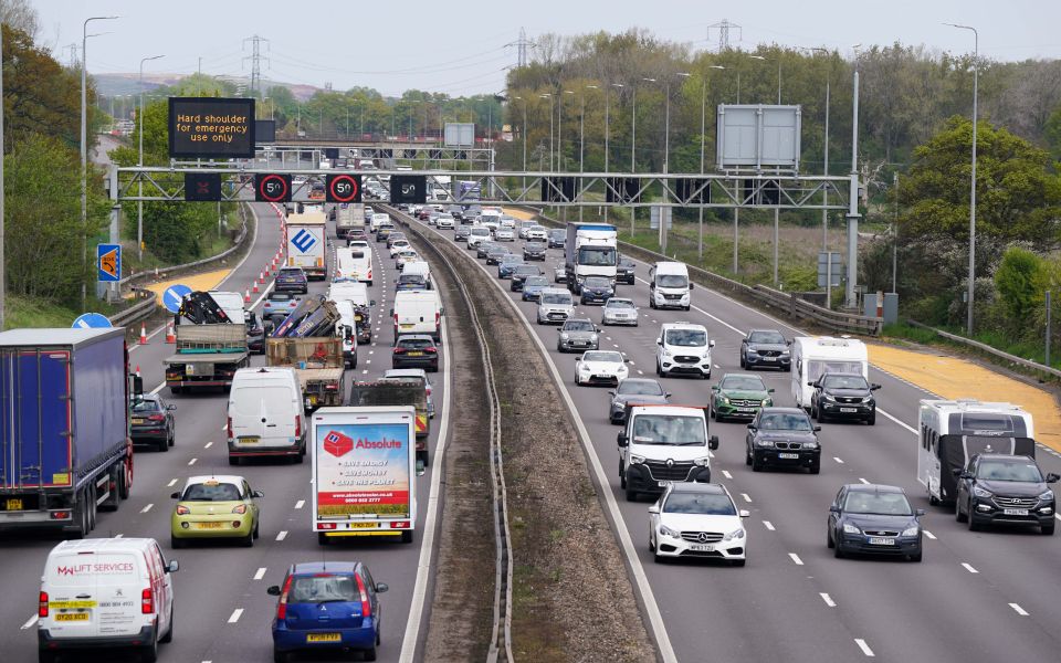 a highway with a sign that says hard shoulders for emergency vehicles