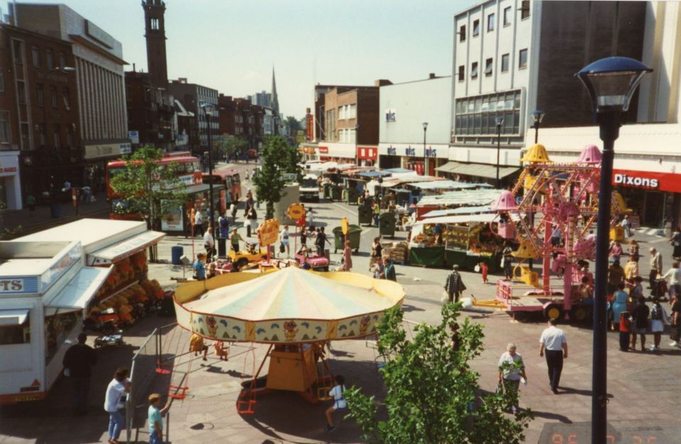 a dixons store is on the right side of the street