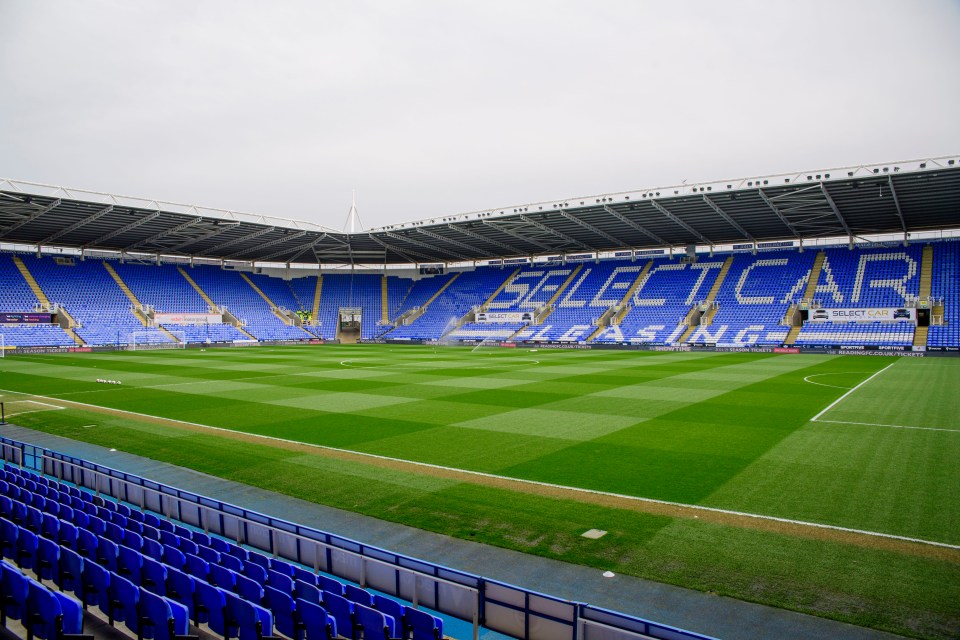 an empty soccer stadium with the words select car leasing painted on the stands