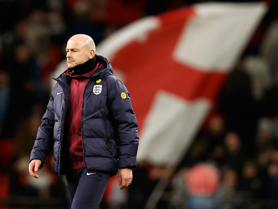 a man wearing a jacket that says england on it