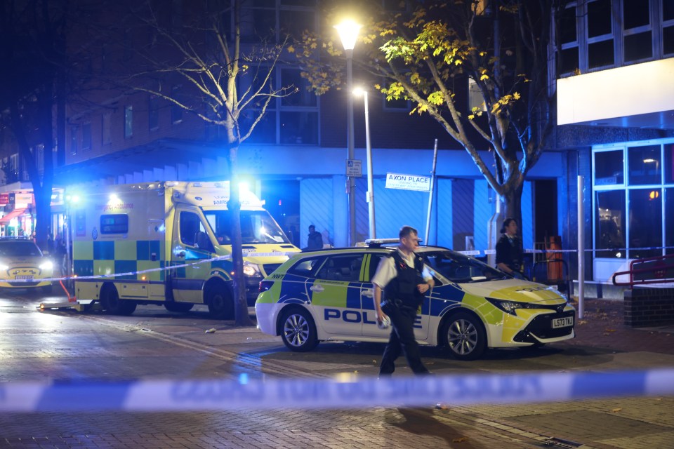 a police car is parked in front of an ambulance