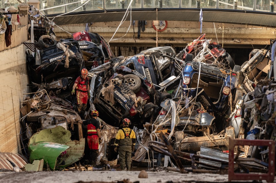 a pile of cars including one that says ' mercedes benz ' on it