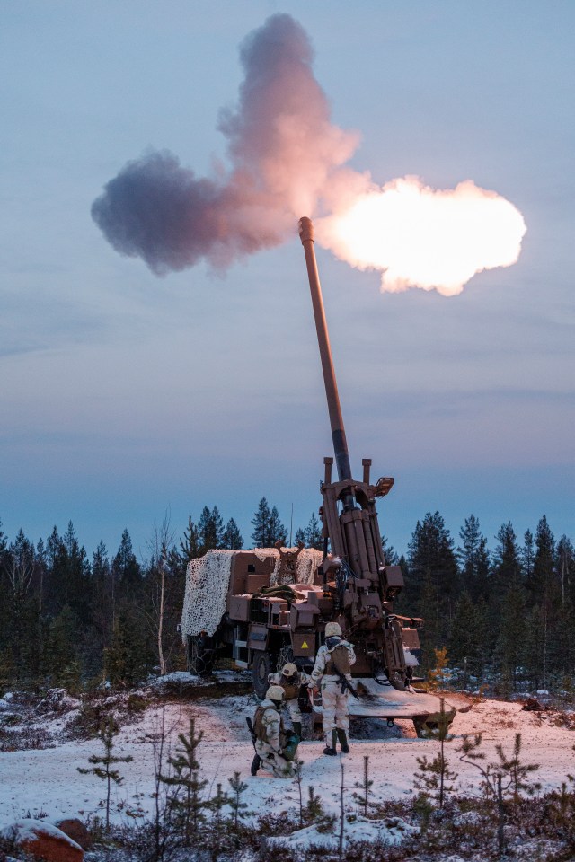 a military cannon is being fired in the snow