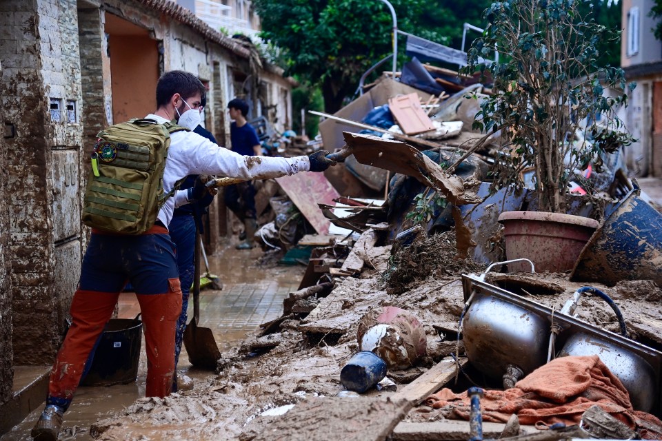 a man wearing a mask and a backpack with the word rescue on it