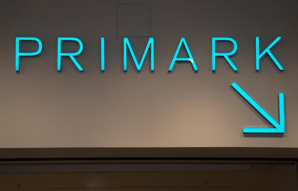 a sign for primark with an arrow pointing to the right