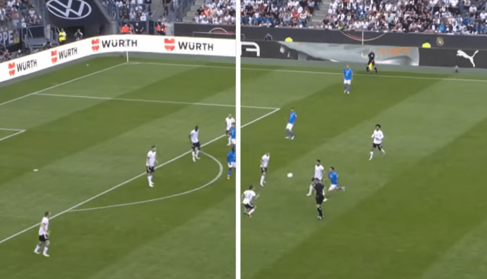 a soccer field with wurth advertisements on the sidelines