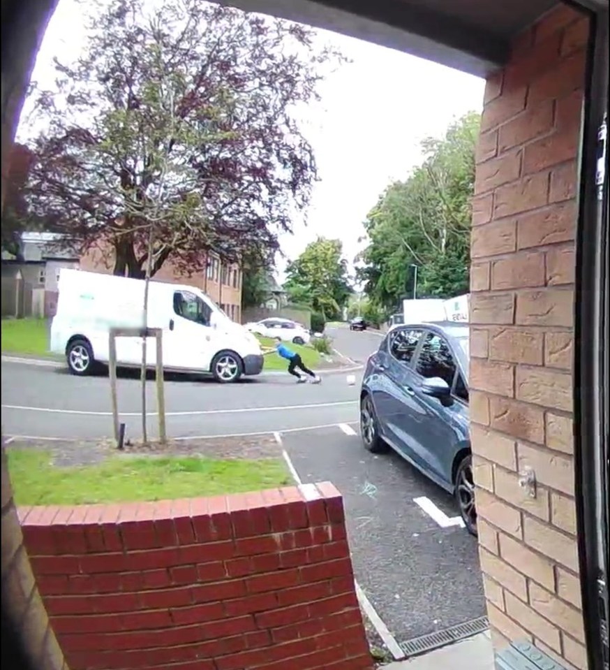 a white van is parked on the side of the road