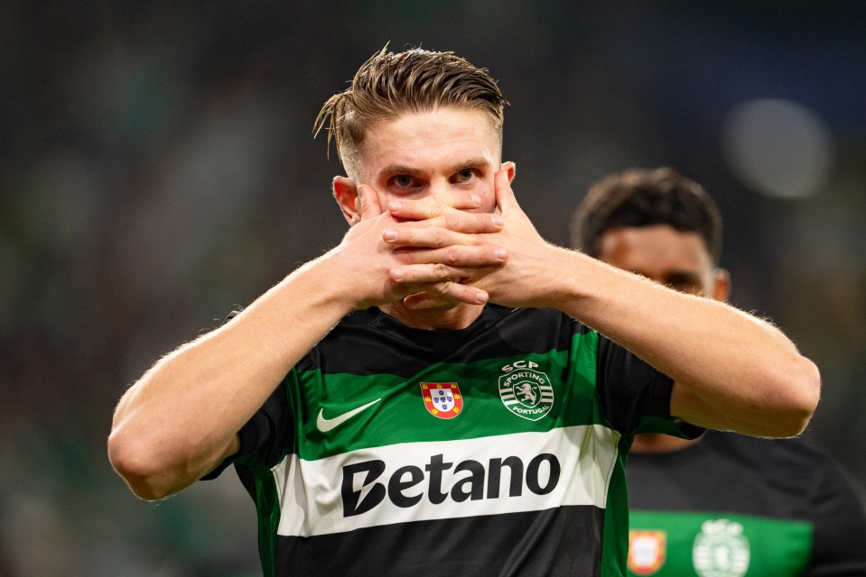 a man wearing a betano jersey covers his mouth with his hands