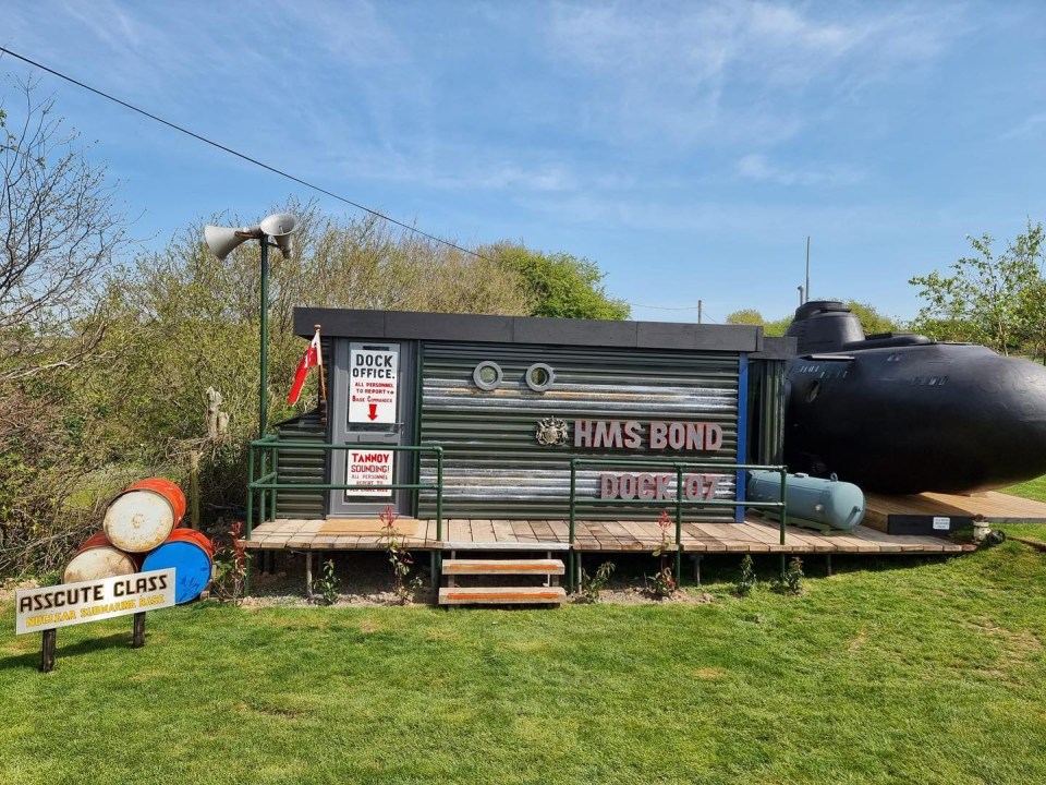 a dock office with a sign that says hms bond