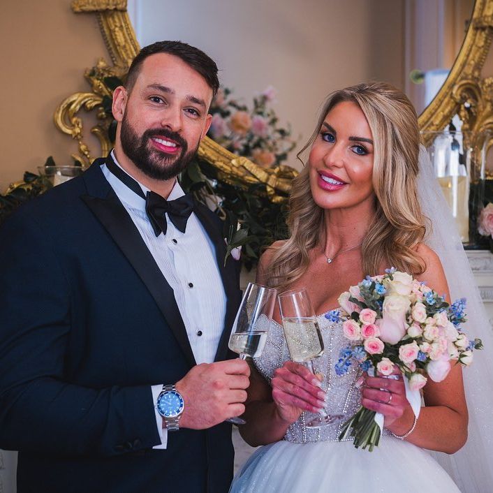 a bride and groom toasting with champagne glasses
