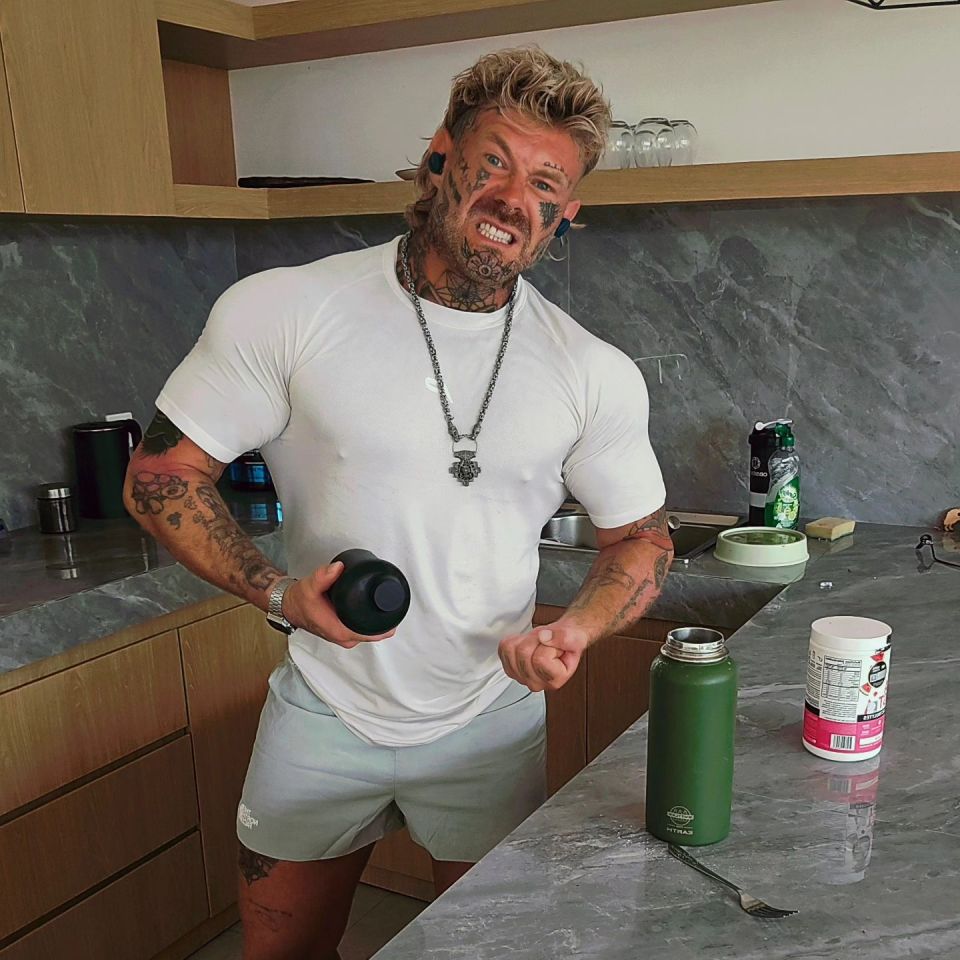 a man in a white shirt is holding a green bottle