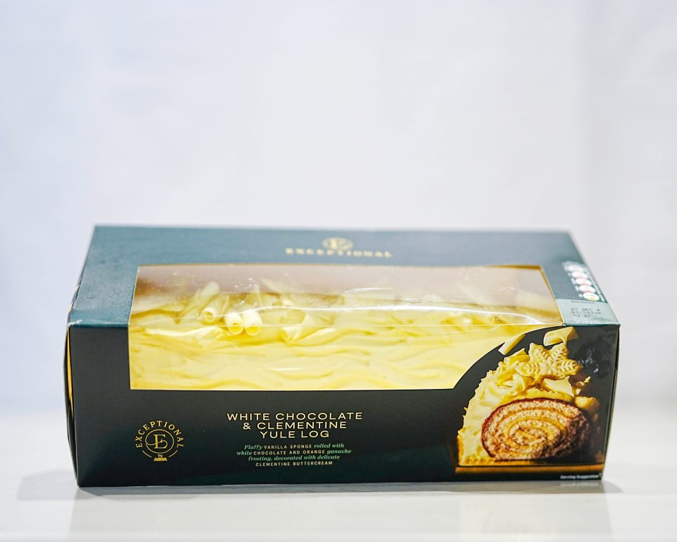 White chocolate and clementine yule log in its box.