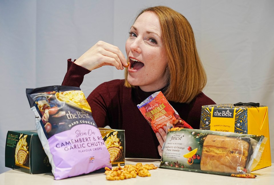 A woman samples various Christmas snacks.