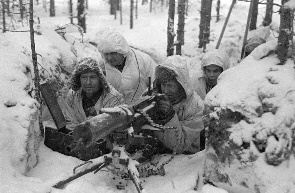 Finnish soldiers manning a Maxim machine gun during the Winter War.