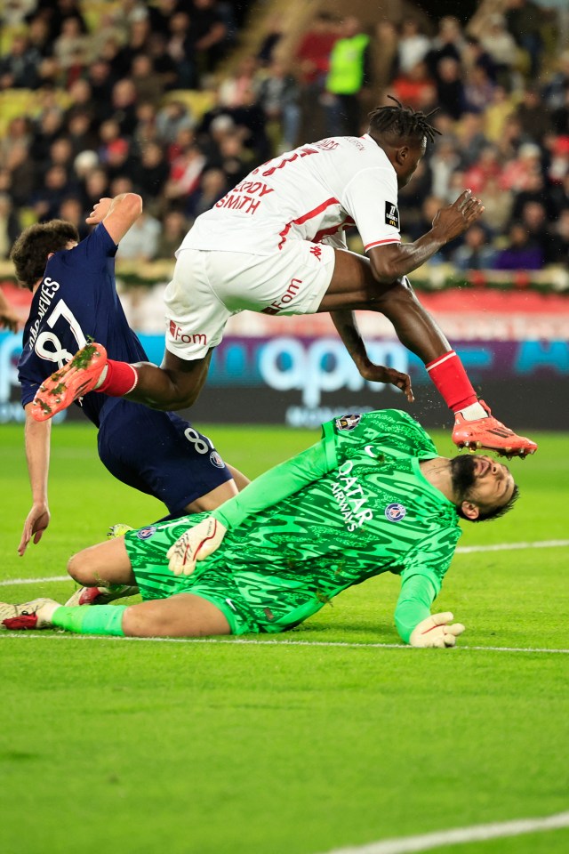 Monaco's Wilfried Singo accidentally kicks Paris Saint-Germain's Gianluigi Donnarumma in the face.
