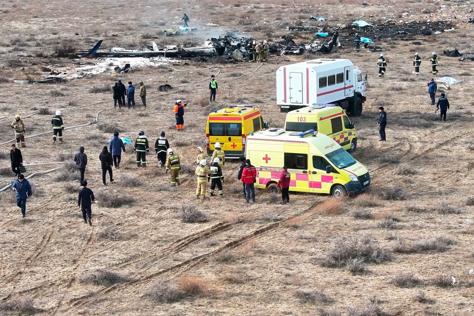 Wreckage of an Azerbaijan Airlines Embraer 190 near Aktau airport with emergency responders.