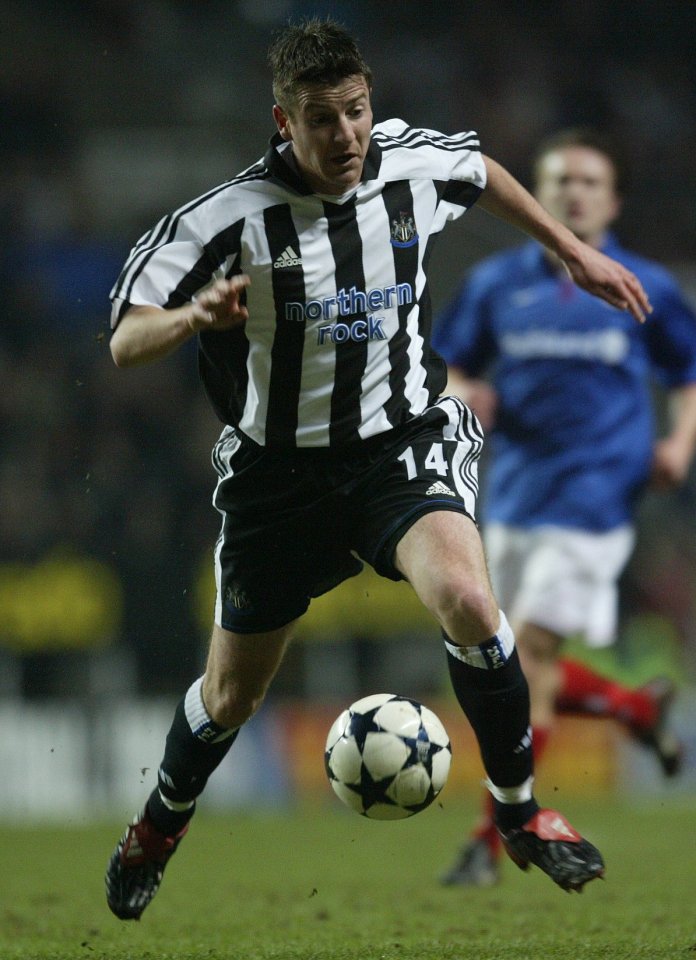 Michael Bridges #14 of Newcastle United dribbling the ball.