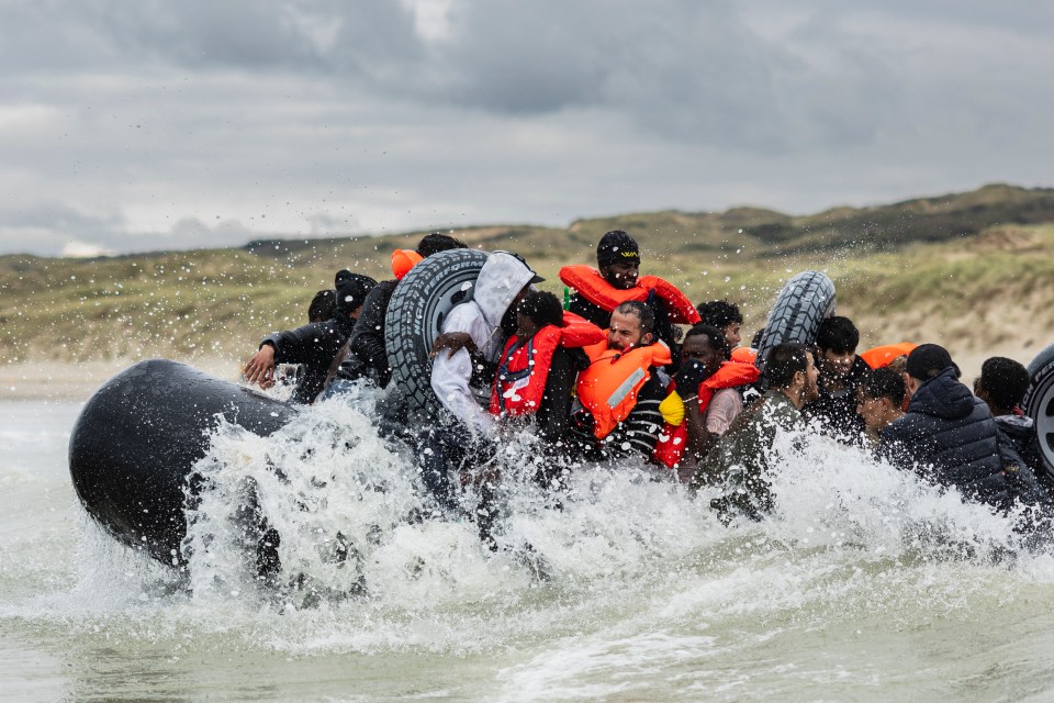 Migrants in an overcrowded inflatable boat crossing the English Channel.