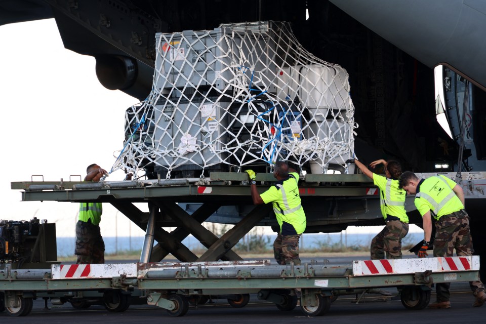Emergency aid being unloaded from a military aircraft in Mayotte.