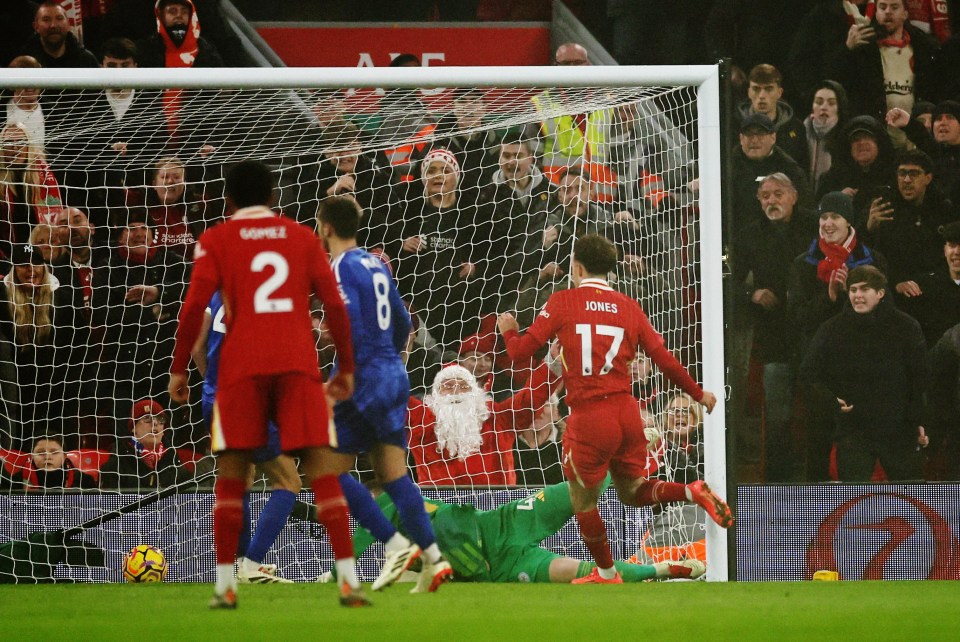 Curtis Jones scores a goal for Liverpool.