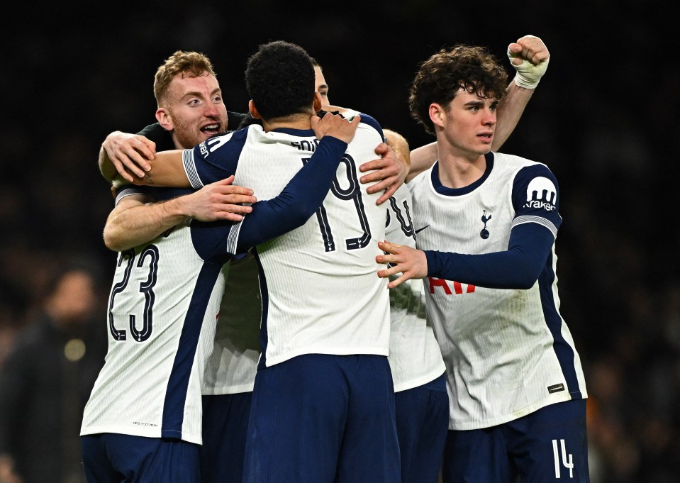 Tottenham Hotspur players celebrating a goal.