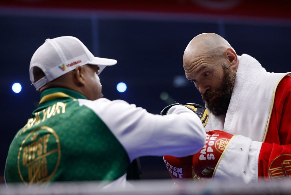 Tyson Fury and his trainer SugarHill Steward before a boxing match.