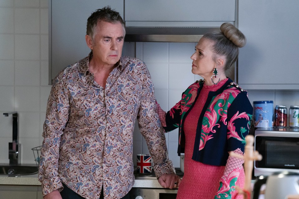 Alfie Moon and Linda Carter in a kitchen.