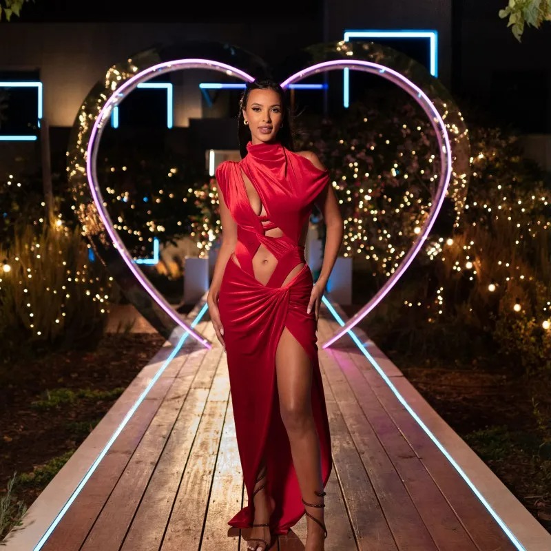 Maya Jama in a red dress at the Love Island villa.