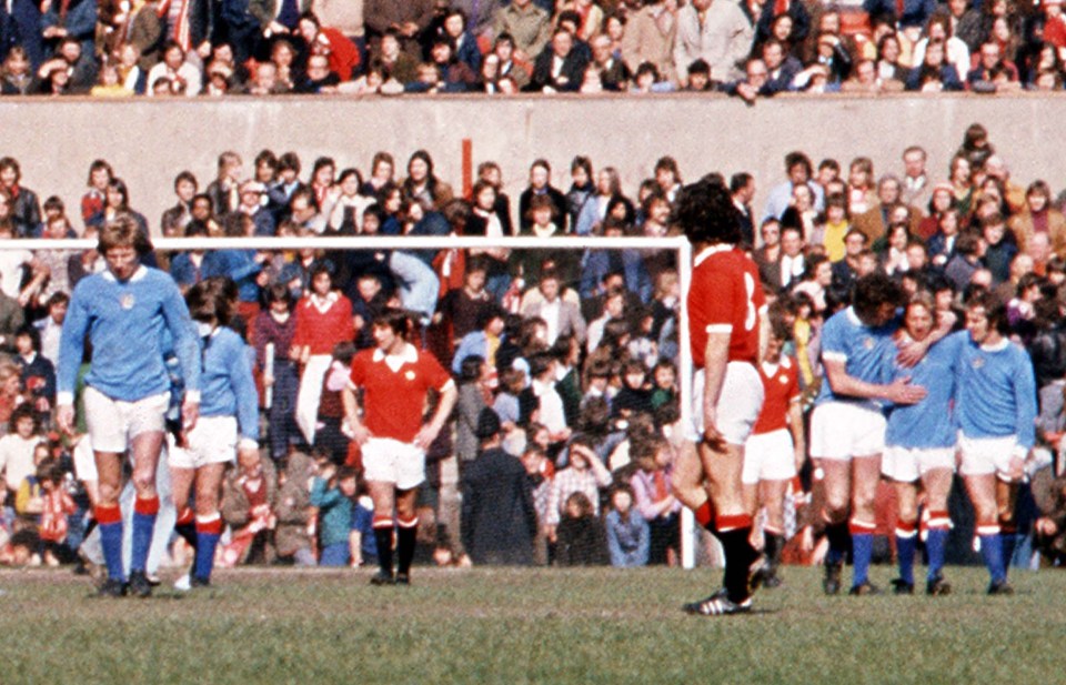 Mandatory Credit: Photo by Colorsport/REX (3042018a) DENIS LAW (City) is congratulated after scoring the goal that Relegated his old club Colin Bell (left) MANCHESTER UNITED V MANCHESTER CITY 27/4/1974 Man Utd 0 Man City 1 Sport