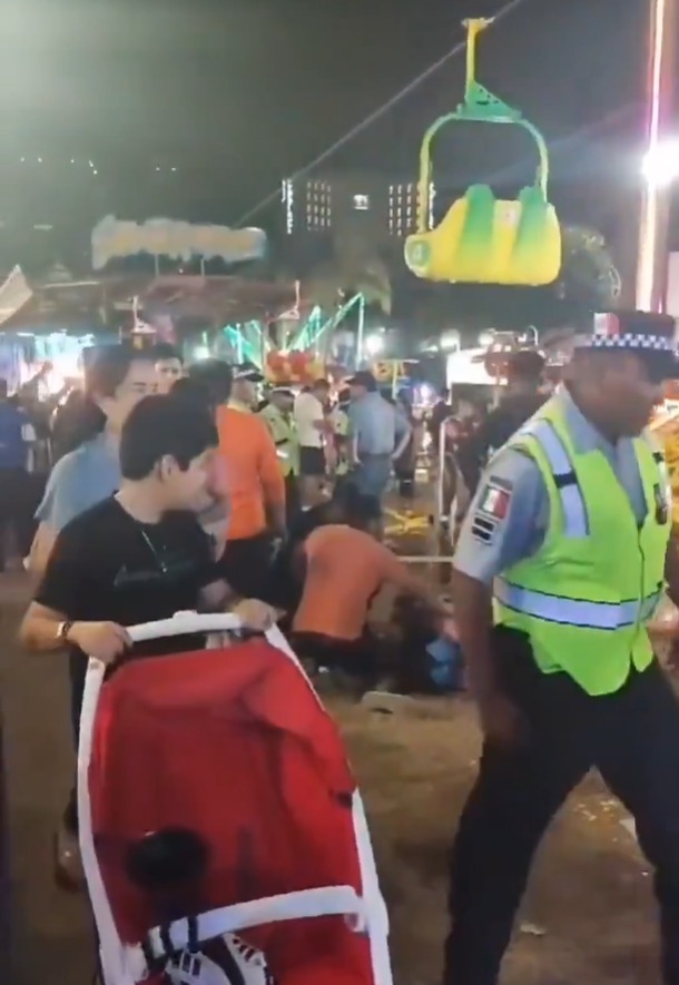 Emergency personnel and military personnel at the scene of a cable car tower collapse at a fair in Acapulco, Mexico.