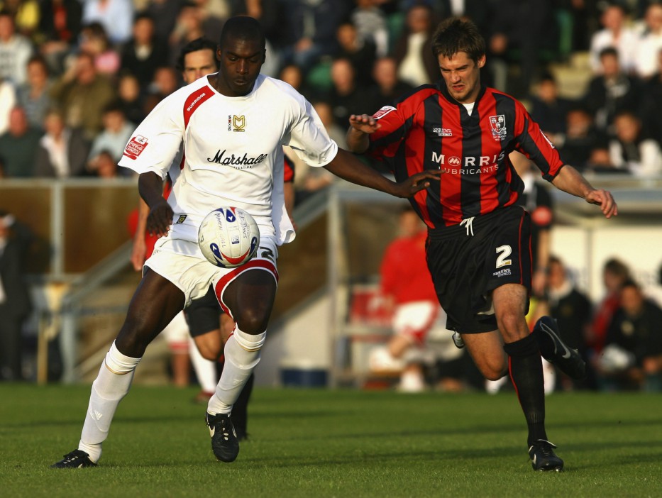 MILTON KEYNES, UNITED KINGDOM - MAY 18:  Jude Stirling of MK Dons is challenged by Danny Hall of Shrewsbury Town during the Coca-Cola Division Two Play-off Semi-Final Second Leg match between MK Dons and Shrewsbury Town at The National Hockey Stadium on May 18, 2007 in Milton Keynes, England.  (Photo by Mark Thompson/Getty Images)