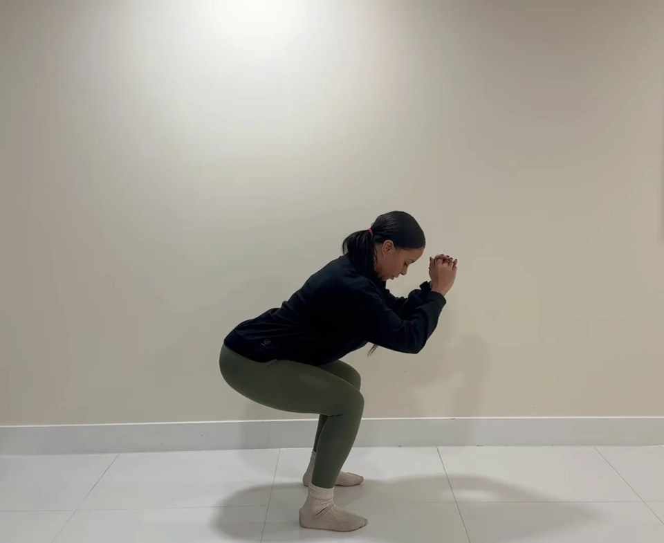 Woman performing a pelvic floor exercise.