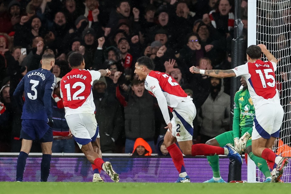 epa11757737 William Saliba of Arsenal (C) celebrates scoring the 2-0 goal during the English Premier League soccer match between Arsenal FC and Manchester United, in London, Britain, 04 December 2024. EPA/NEIL HALL EDITORIAL USE ONLY. No use with unauthorized audio, video, data, fixture lists, club/league logos, 'live' services or NFTs. Online in-match use limited to 120 images, no video emulation. No use in betting, games or single club/league/player publications.