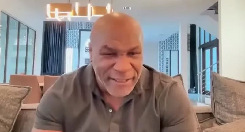 Mike Tyson smiling in a video.