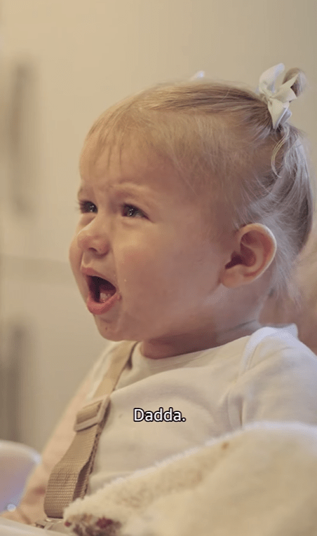 Crying toddler saying "Dadda."