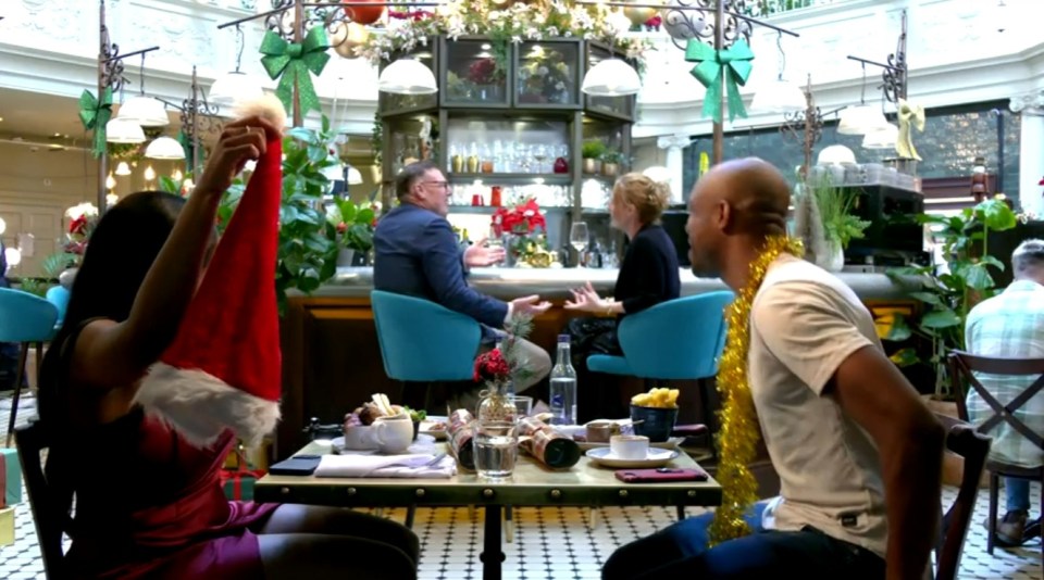 People gathered at a festive restaurant.
