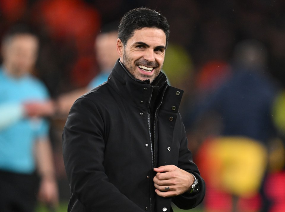 Mikel Arteta, Arsenal manager, smiling.
