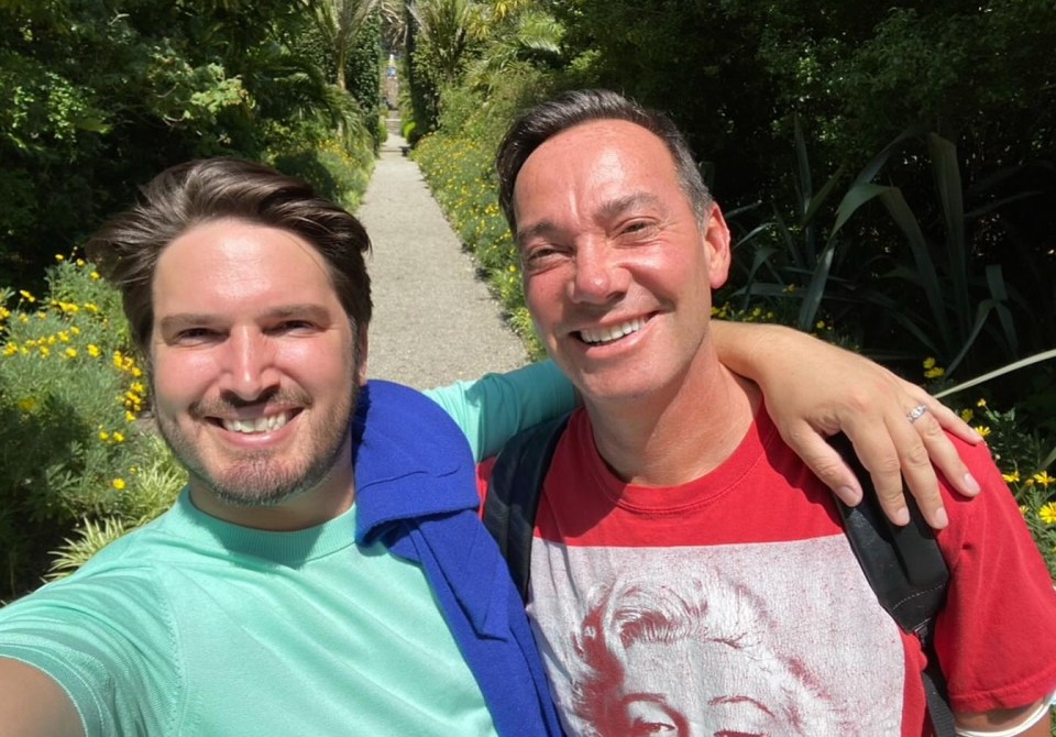 Craig Revel Horwood and Jonathan Myring in a garden.
